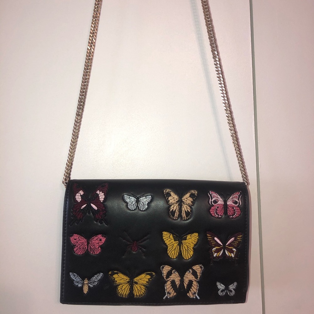 Black faux leather purse with butterfly design